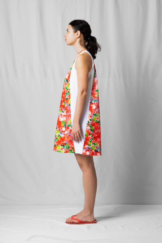 Short, wide pink flowers halter dress with a two-fabric detail and button fastening at the back from the SS26 collection by STEF SERIES