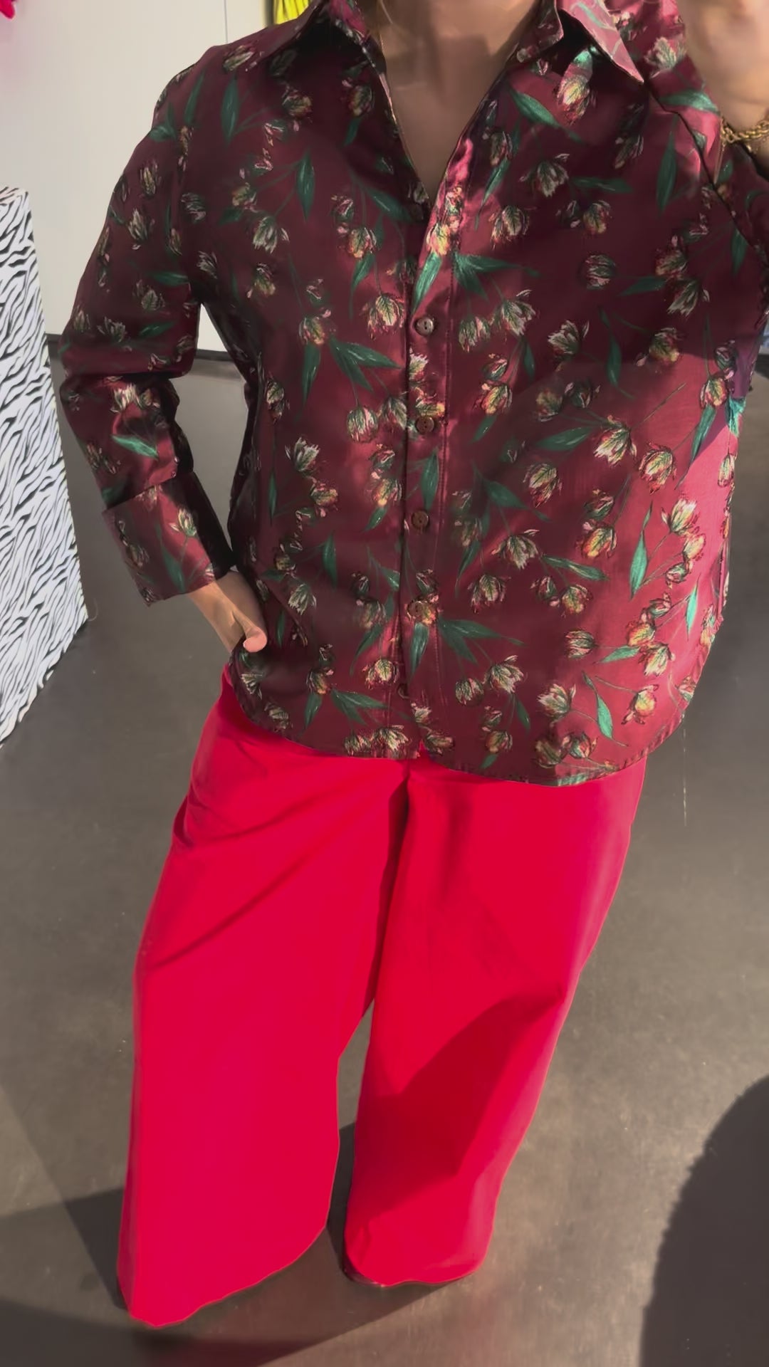 The STEF SERIES Coby long-sleeve shirt in a red floral print combined with the Caro Pants in red velvet from the Autumn Winter 2026 Collection.