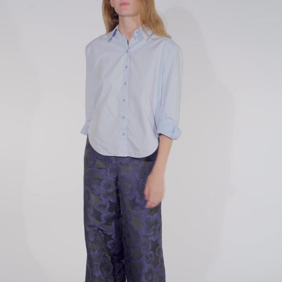Video of Model wearing a floral trousers women Ash in black and blue from STEF SERIES AW25