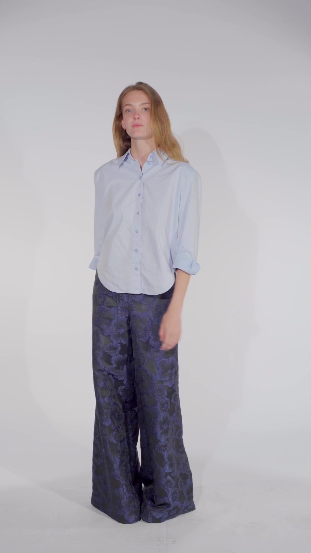 Video of Model wearing a floral trousers women Ash in black and blue from STEF SERIES AW25