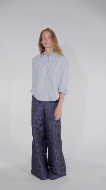 Video of Model wearing a floral trousers women Ash in black and blue from STEF SERIES AW25