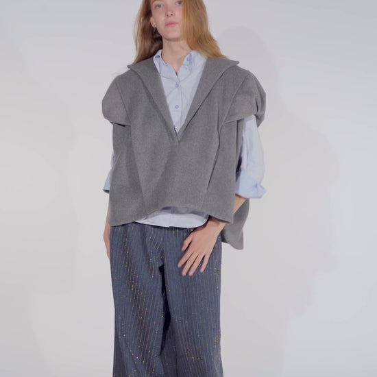 Video of model showing Aiko grey wool vest top women with Ash denim pants with gold studs from STEF SERIES AW25.