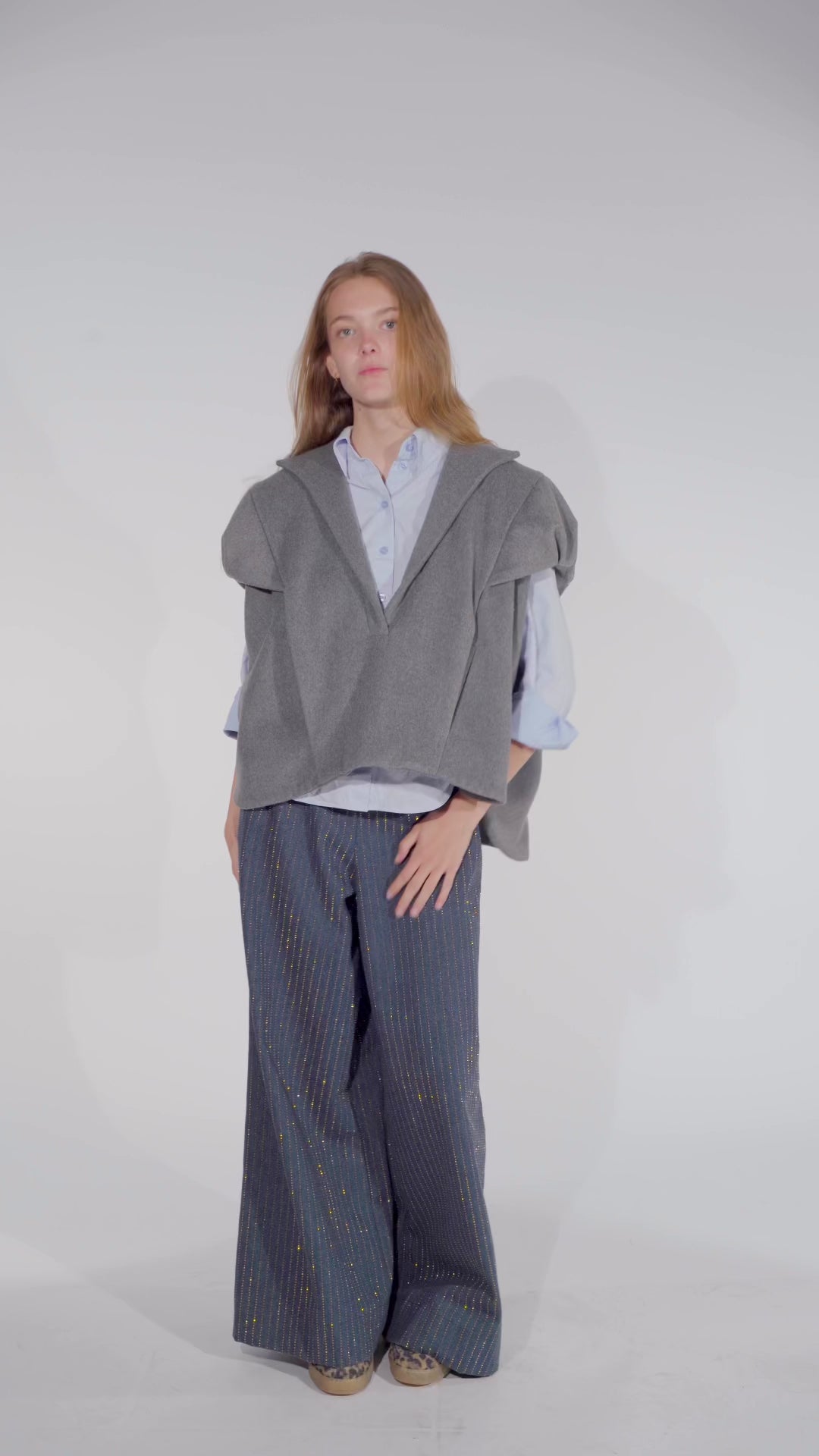 Video of model showing Aiko grey wool vest top women with Ash denim pants with gold studs from STEF SERIES AW25.