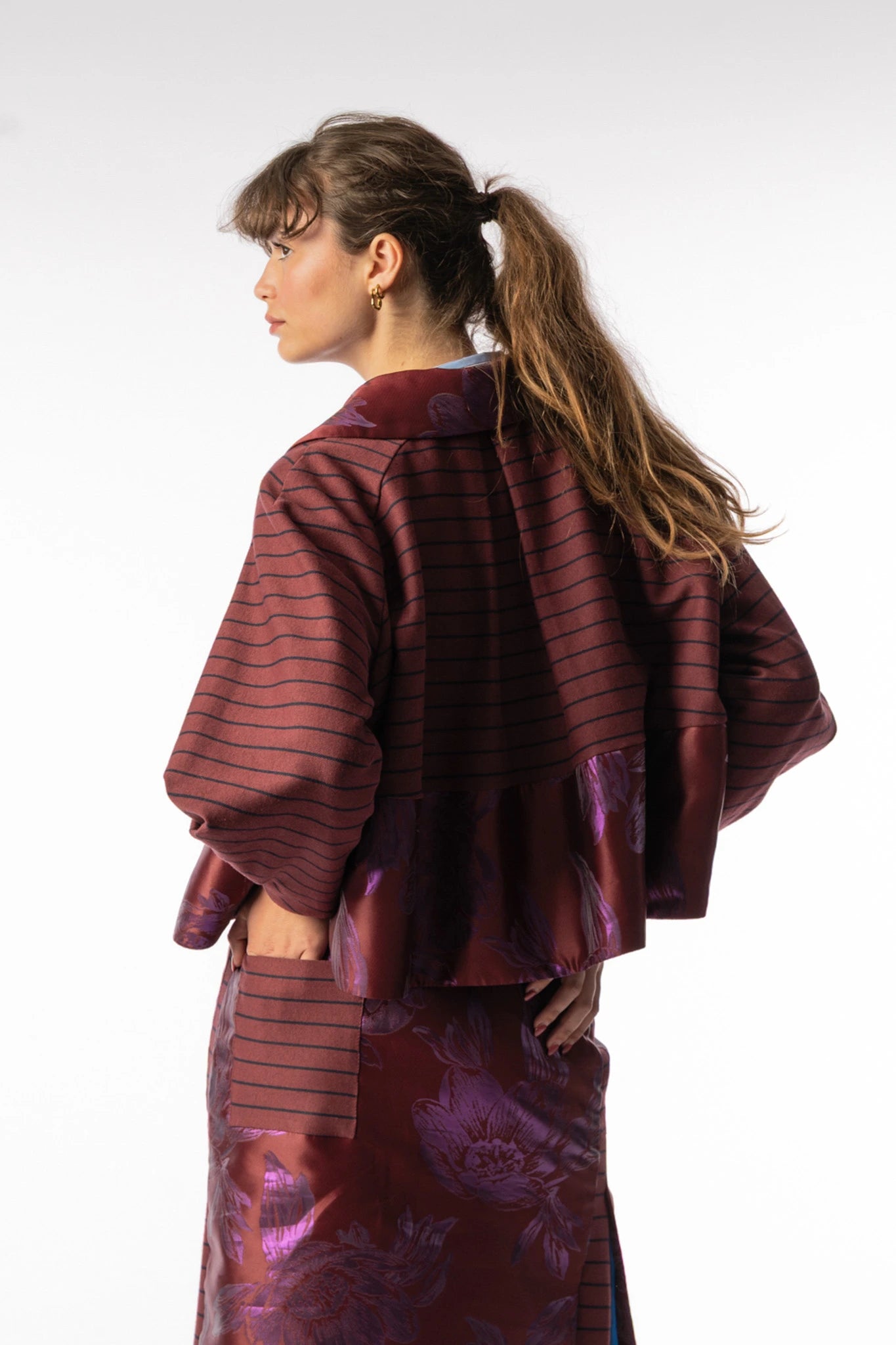 Abel boxy short jacket in bordeaux with florals, AW25 collection by STEF SERIES, back shown from side.