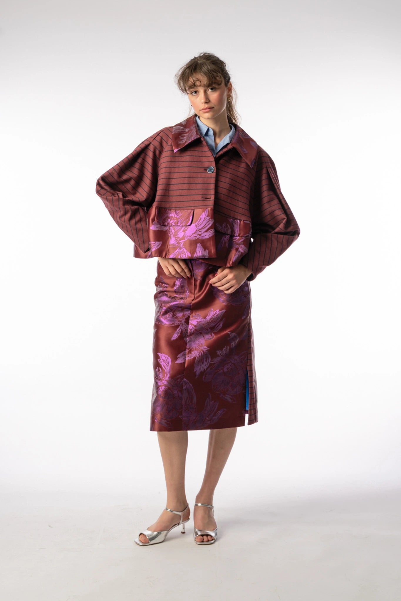 Abel boxy short jacket and Asil skirt in bordeaux with florals, AW25 collection by STEF SERIES, shown from front.