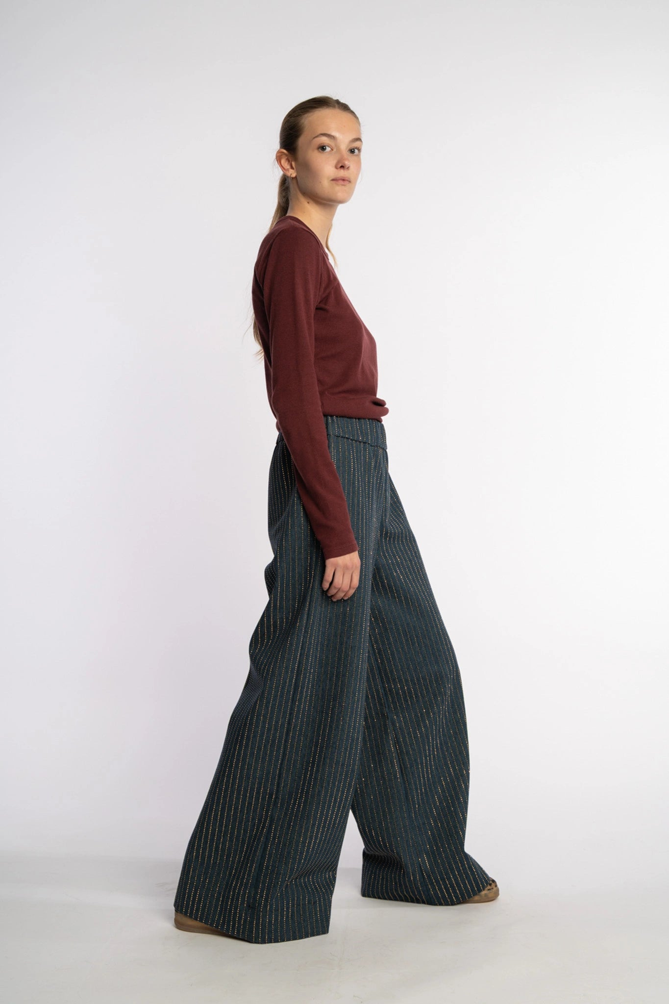 Dark denim pants Ash with gold studs from the STEF SERIES Autumn Winter Collection 2025, shown from right side.