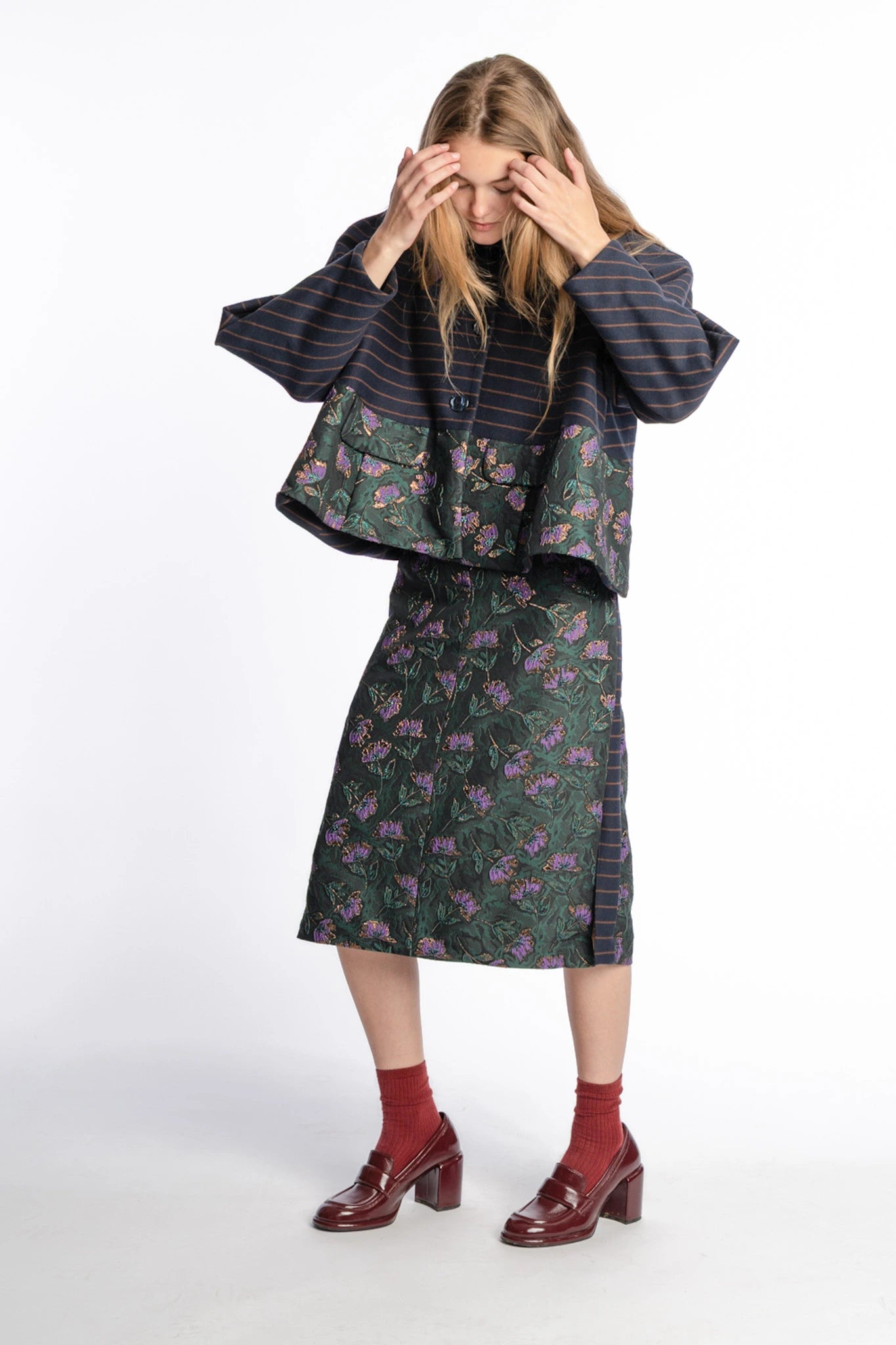 Floral slide-slit skirt Asil in pinegreen and purple from STEF SERIES AW25, front shown from side.