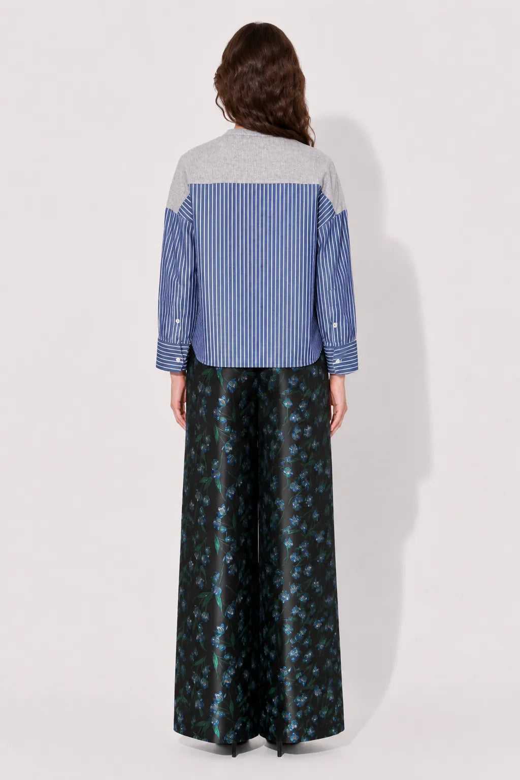 Back view of the STEF SERIES Caro wide-leg pants in a blue floral print. 