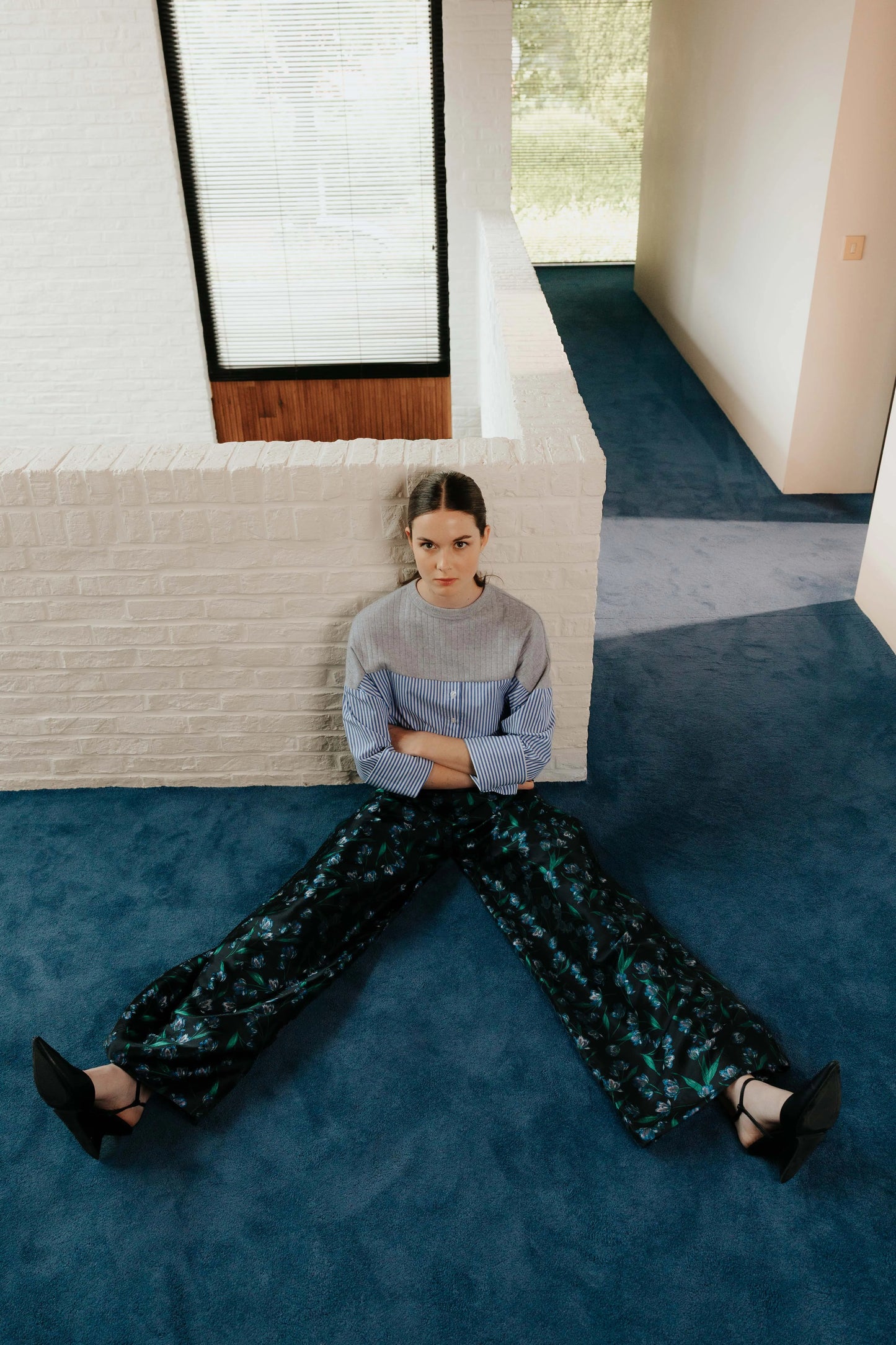 Model the STEF SERIES Caro wide-leg pants in a blue floral print from the Autumn Winter Collection 2026. 