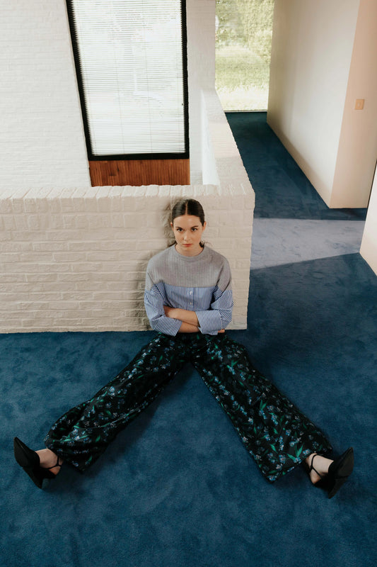 Model the STEF SERIES Caro wide-leg pants in a blue floral print from the Autumn Winter Collection 2026. 