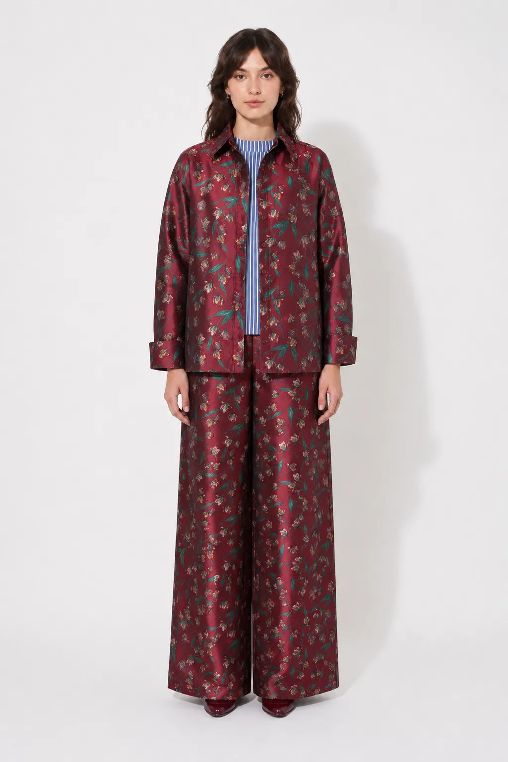Front view of the STEF SERIES Caro wide-leg pants in a red floral print. 