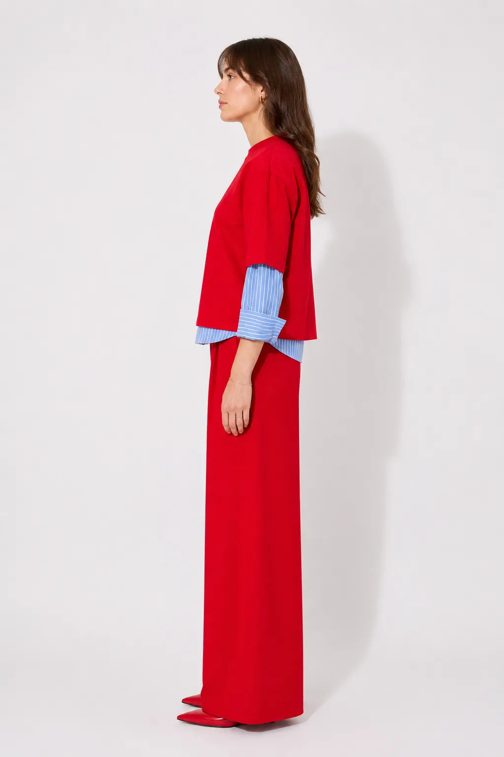 Side view of the STEF SERIES Caro wide-leg pants in a red velvet.