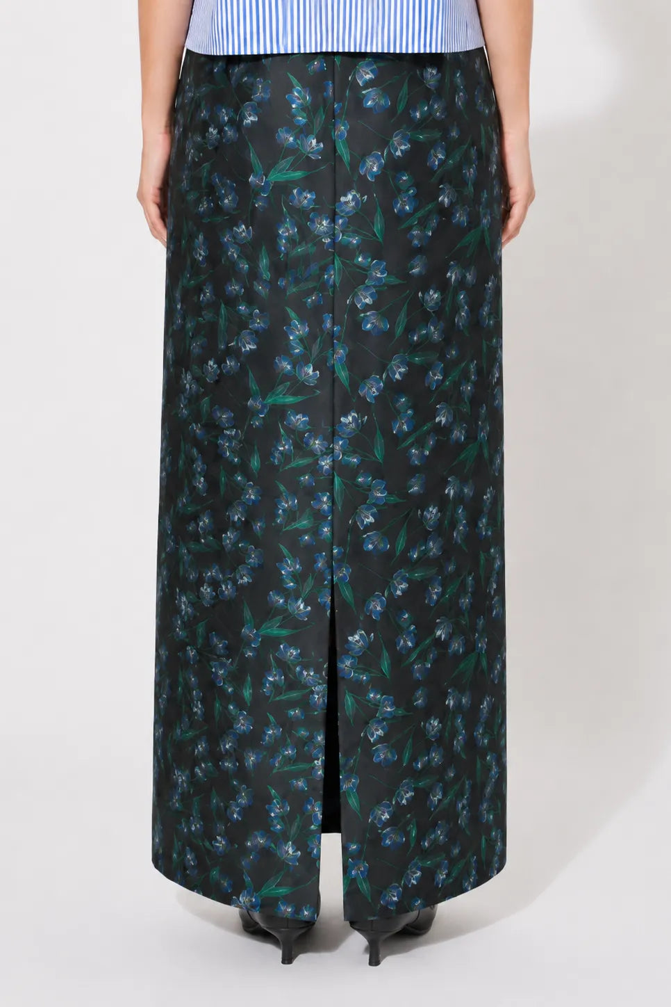 Close-up shot of the back of the STEF SERIES Cas maxi skirt in blue floral print. 