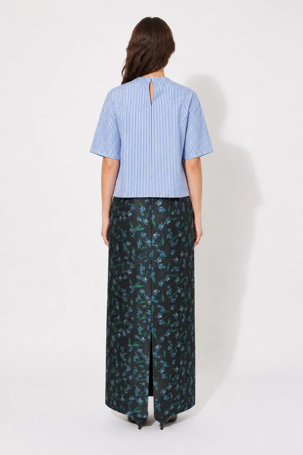 Back view of the STEF SERIES Cas maxi skirt in blue floral print. 