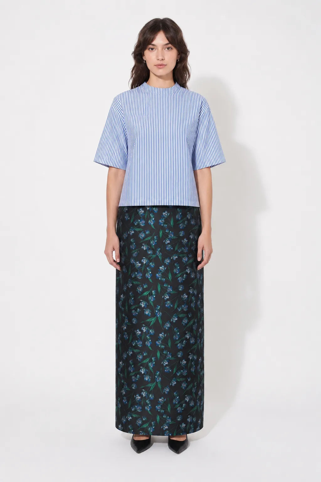 Front view of the STEF SERIES Cas maxi skirt in blue floral print. 