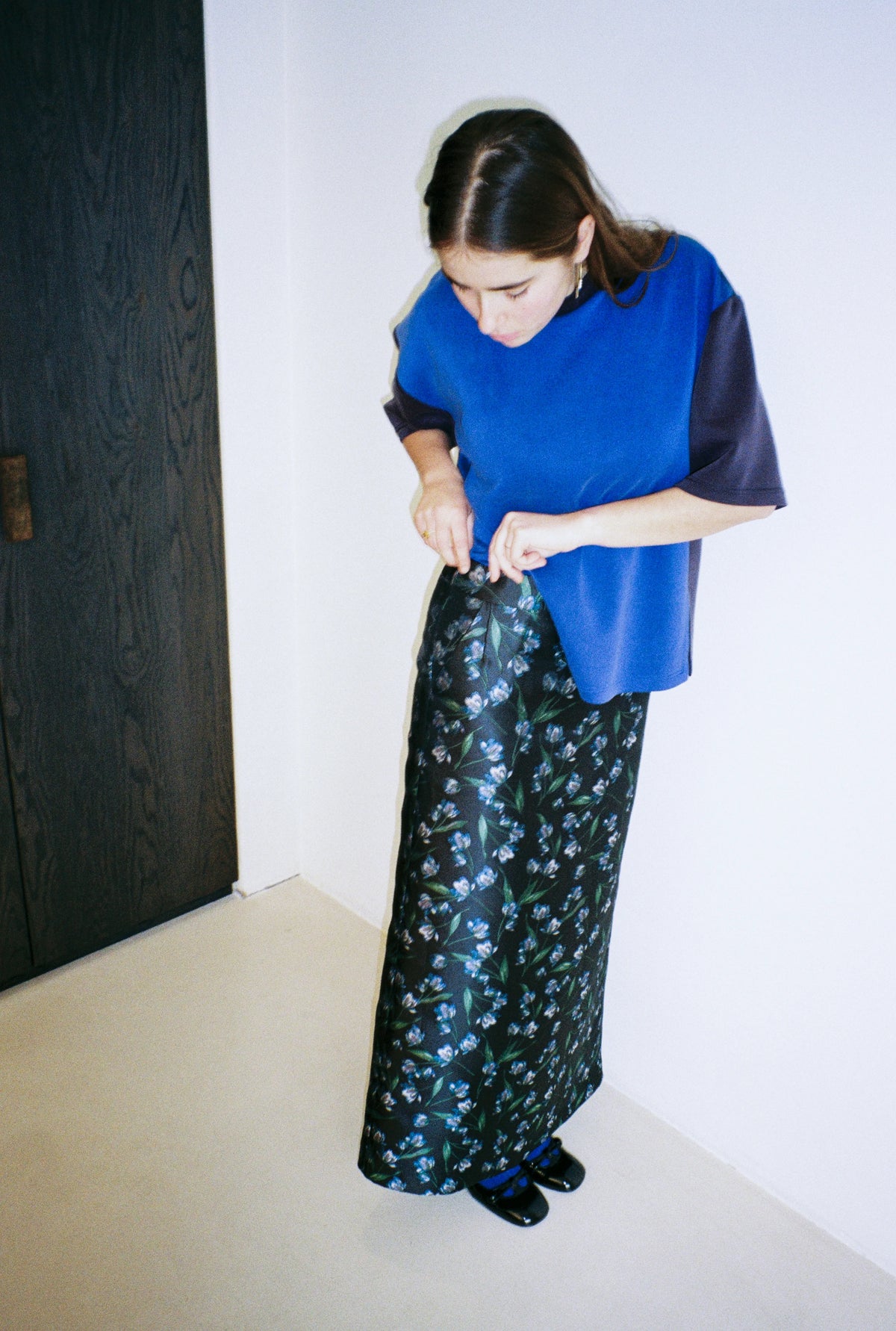 Model wearing the STEF SERIES Cas maxi skirt in a blue foral print from the Autumn Winter 2026 Collection.