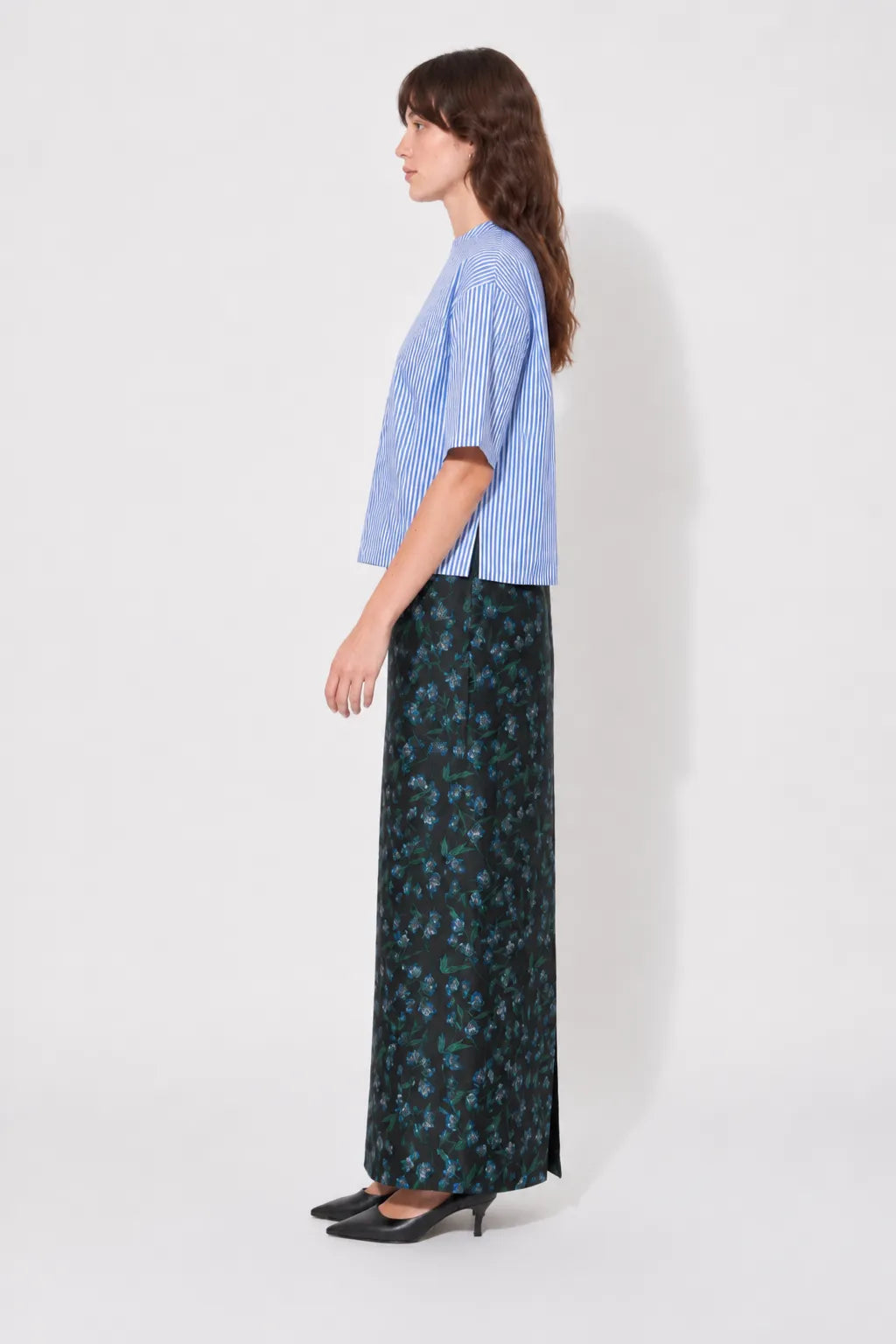 Side view of the STEF SERIES Cas maxi skirt in blue floral print. 