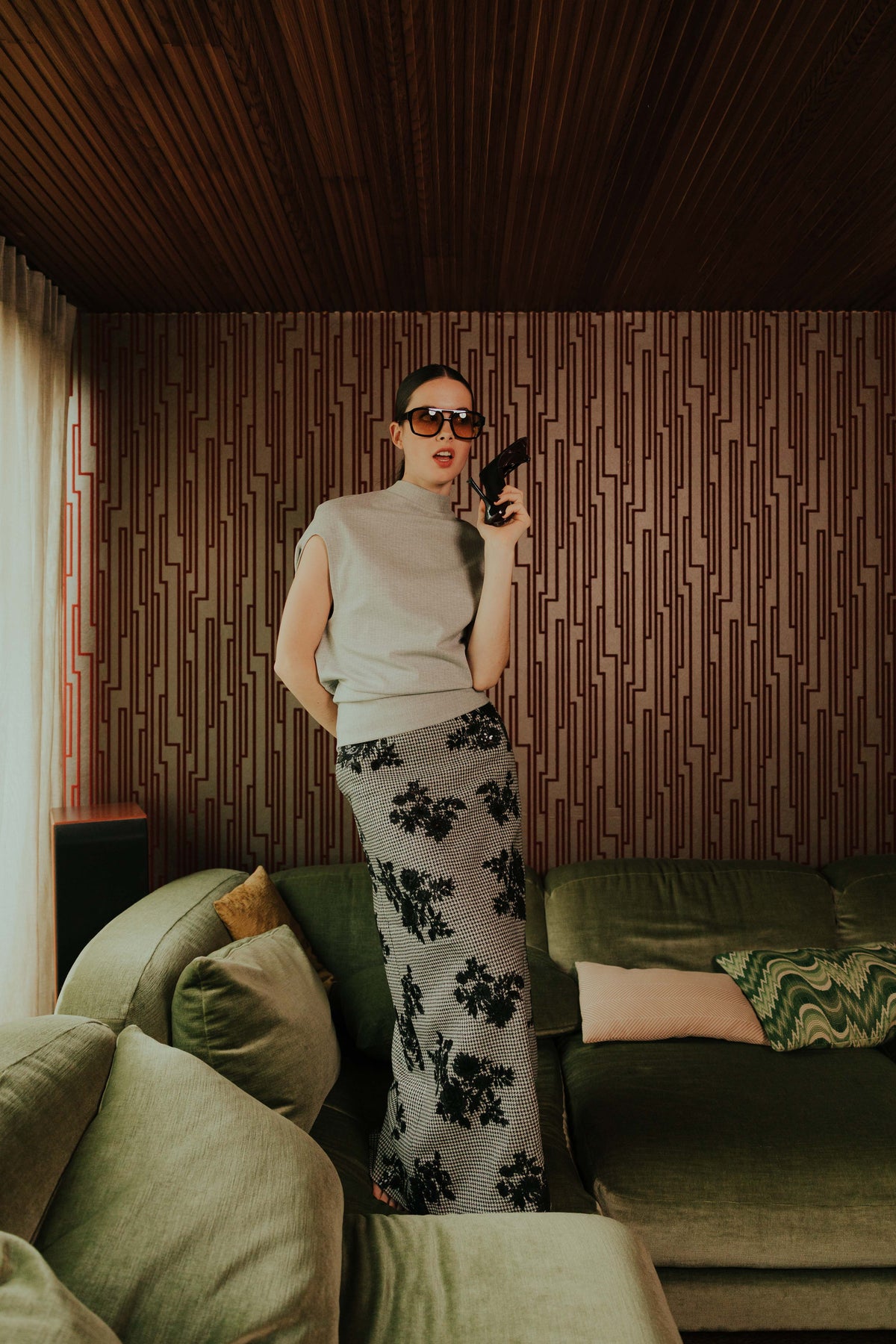 Model wearing the STEF SERIES Cas maxi skirt in pied-de-poule fabric with the Cece balloon shirt in grey striped jersey, both from the Autumn Winter 2026 Collection.