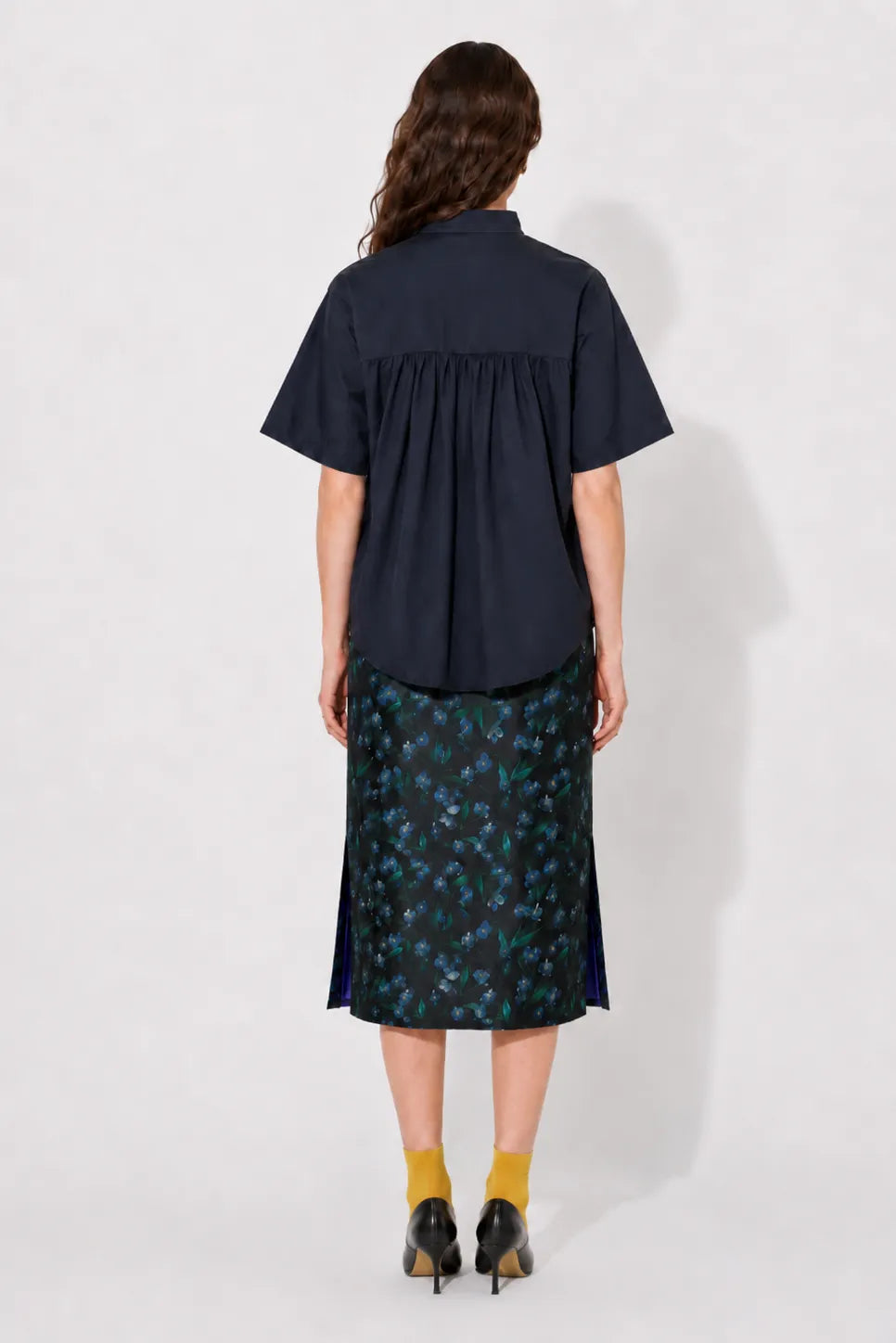 Back view of the STEF SERIES Casil midi skirt in a blue floral print