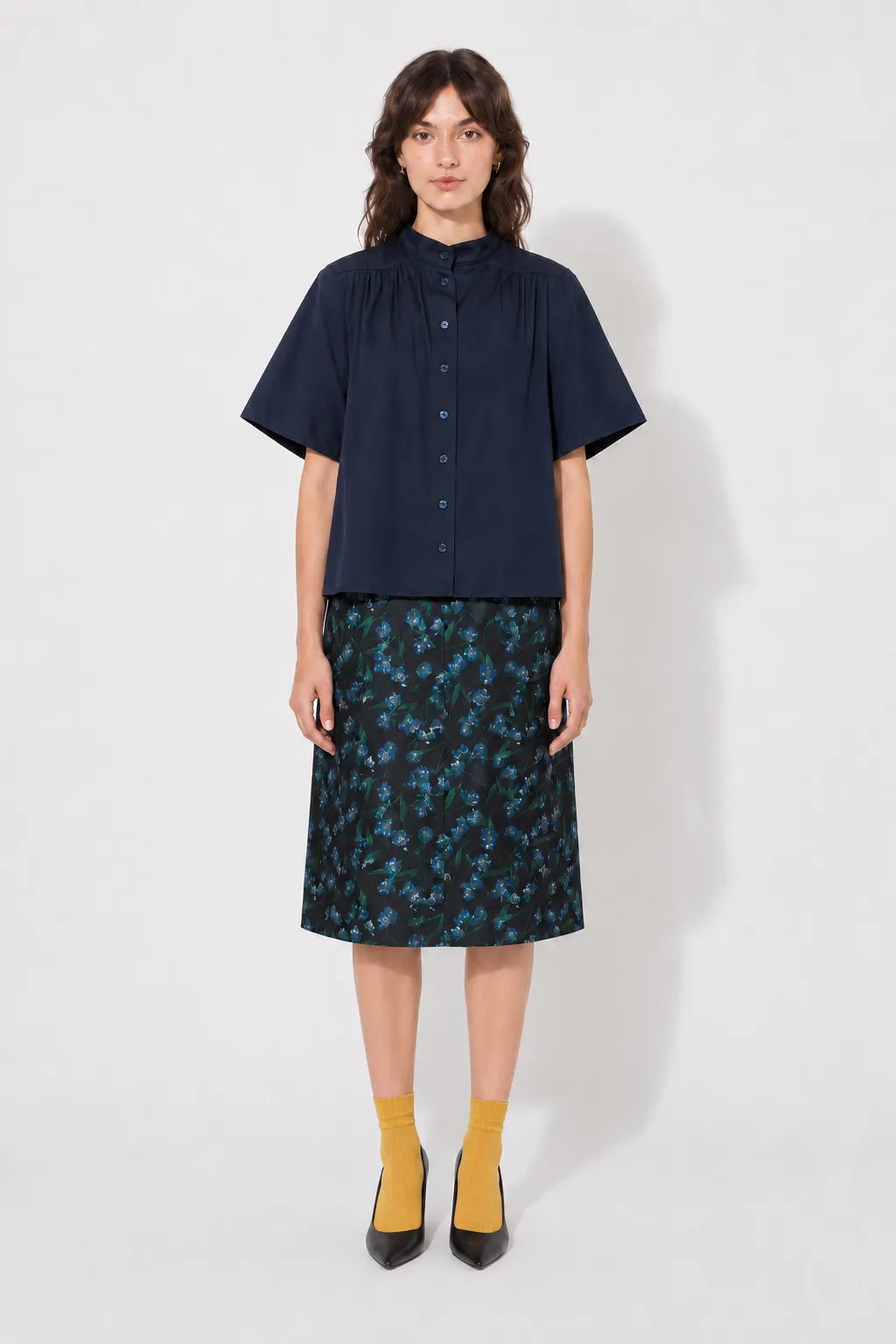 Front view of the STEF SERIES Casil midi skirt in a blue floral print