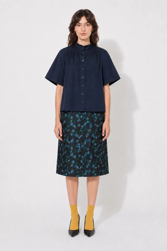 Front view of the STEF SERIES Casil midi skirt in a blue floral print