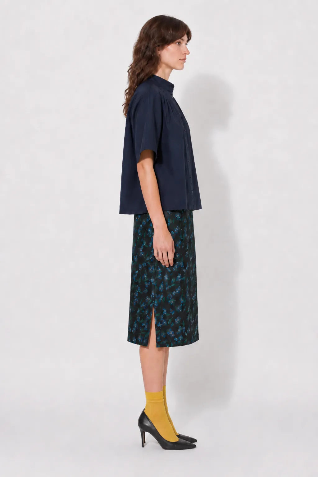 Side view of the STEF SERIES Casil midi skirt in a blue floral print