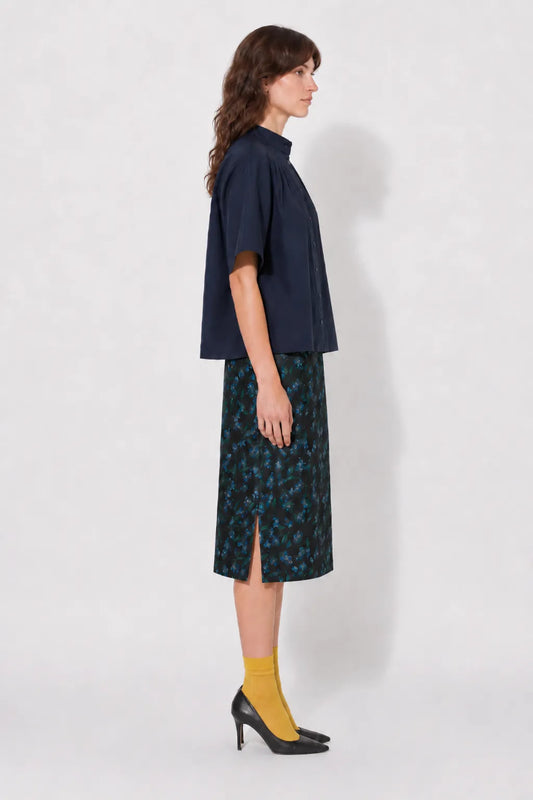 Side view of the STEF SERIES Casil midi skirt in a blue floral print