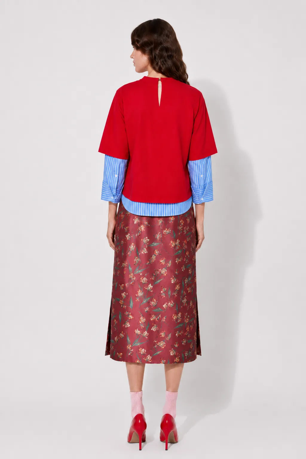 Back view of the STEF SERIES Casil midi skirt in a red floral print.