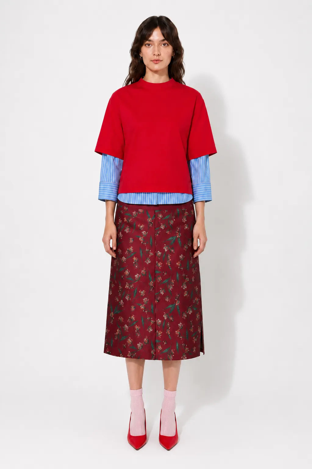 Front view of the STEF SERIES Casil midi skirt in a red floral print.