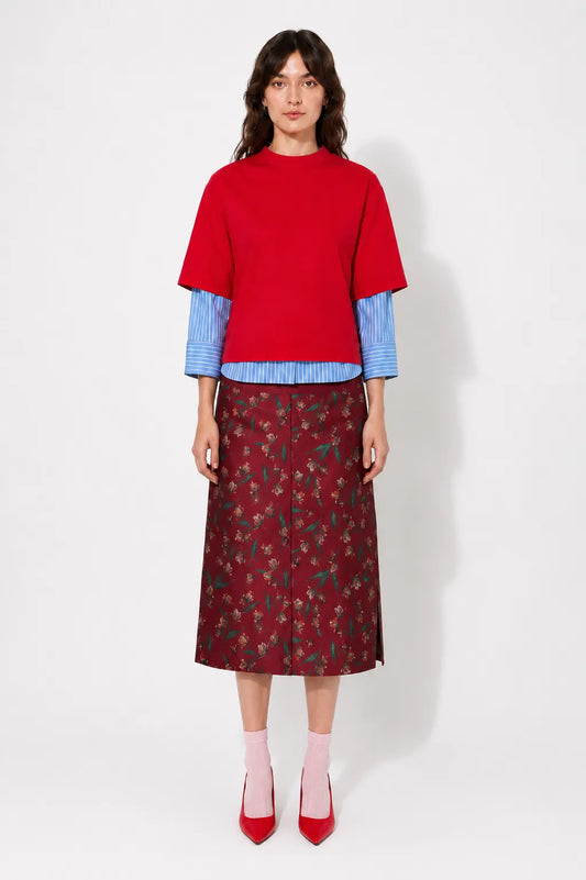 Front view of the STEF SERIES Casil midi skirt in a red floral print.