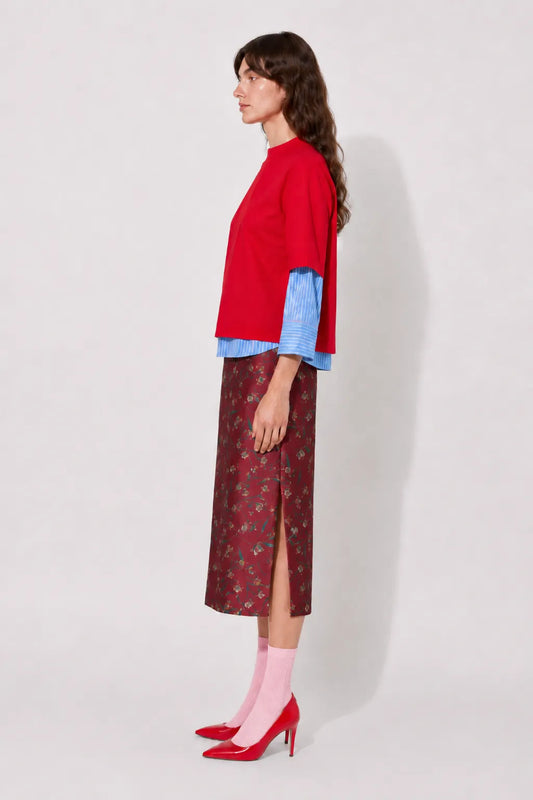 Side view of the STEF SERIES Casil midi skirt in a red floral print.