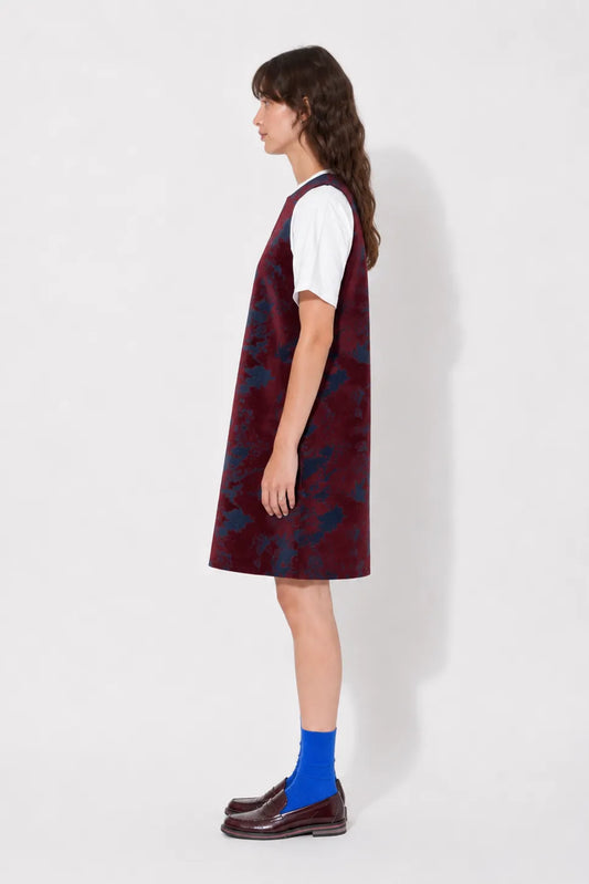Side view of the STEF SERIES Cenny sleeveless mini dress in bordeaux velvet denim.