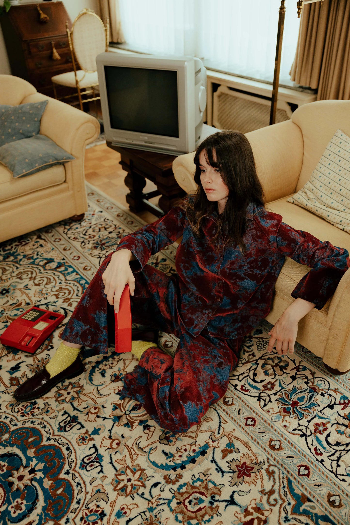 Model wearing the STEF SERIES Chuck barrel pants with the Coby shirt, both crafted from bordeaux velvet denim. Part of the Autumn Winter 2026 Collection.