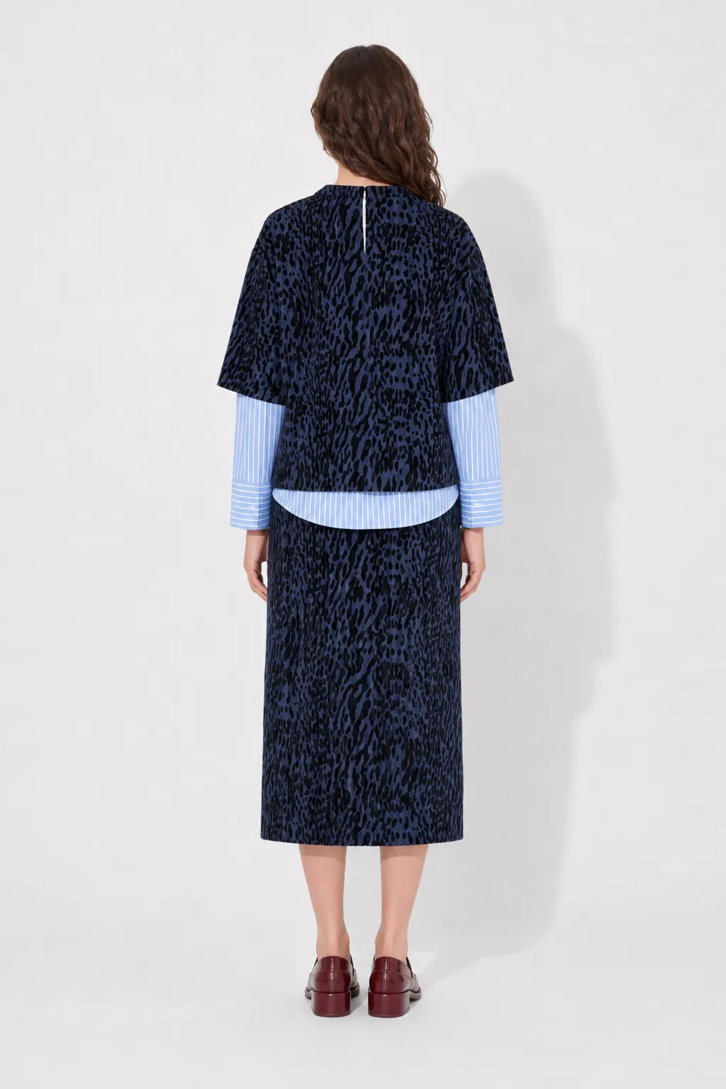 Back view of the STEF SERIES Ciska boxy T-shirt crafted from denim with a distinctive velvet leopard print.