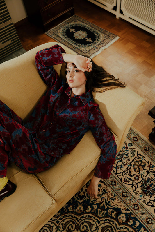 Model wearing the STEF SERIES Coby long sleeve shirt in bordeaux velvet denim from the Autumn Winter collection 2026.