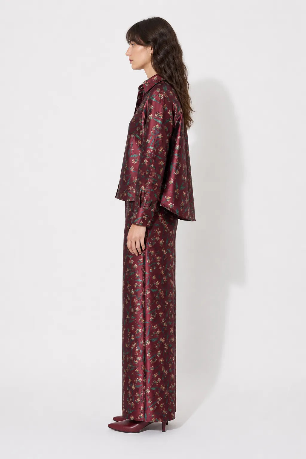 Side view of the STEF SERIES Coby long-sleeve shirt in a red floral print.