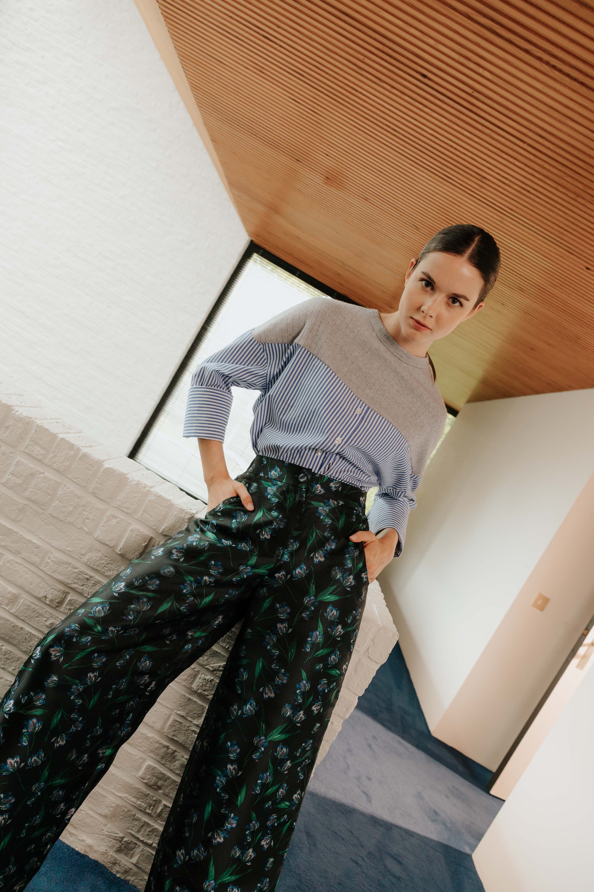 Front view of the STEF SERIES Collin poplin shirt in blue stripes, styled with the Caro blue floral wide-leg pants.
