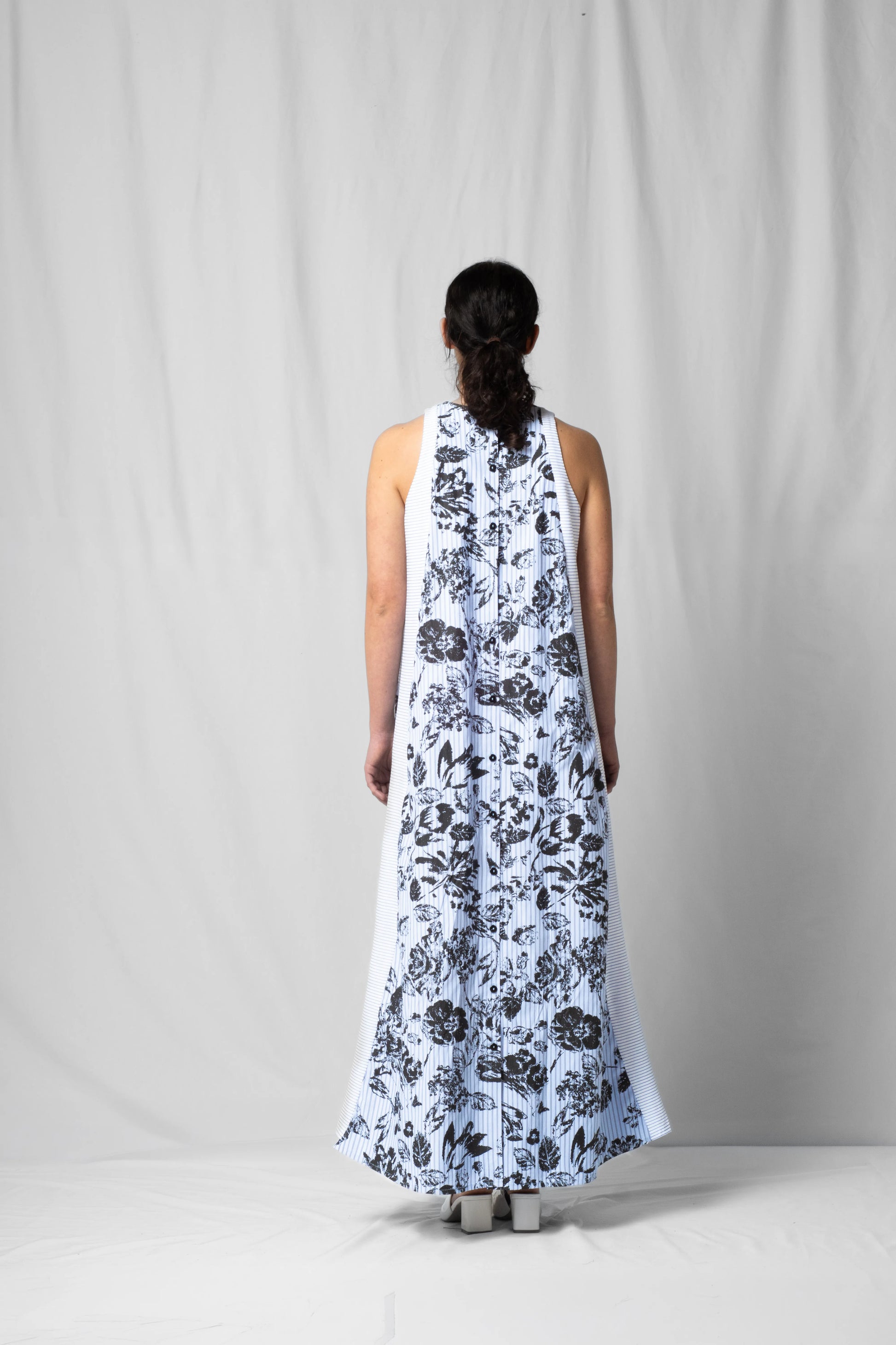 long, wide black flowers halter dress with a two-fabric detail and button fastening at the back from the SS26 collection by STEF SERIES