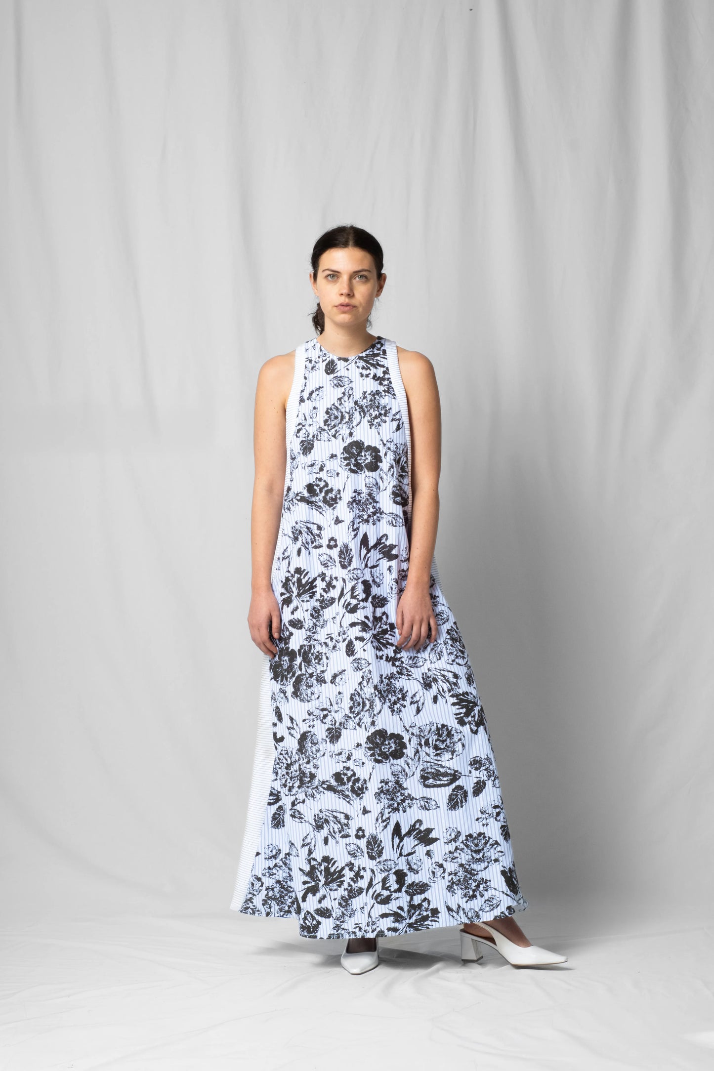 long, wide black flowers halter dress with a two-fabric detail and button fastening at the back from the SS26 collection by STEF SERIES