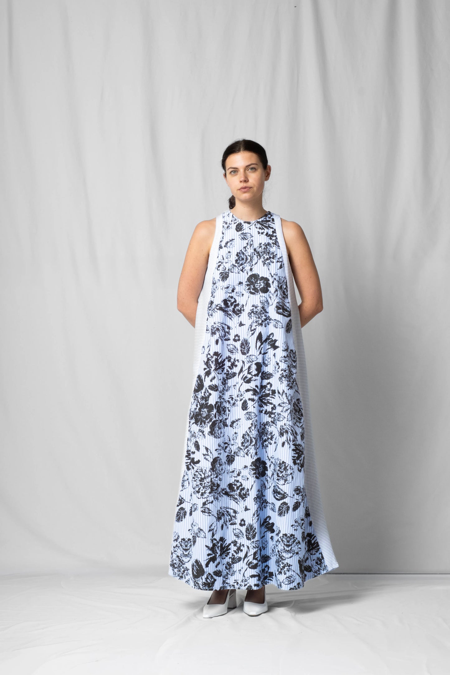 long, wide black flowers halter dress with a two-fabric detail and button fastening at the back from the SS26 collection by STEF SERIES