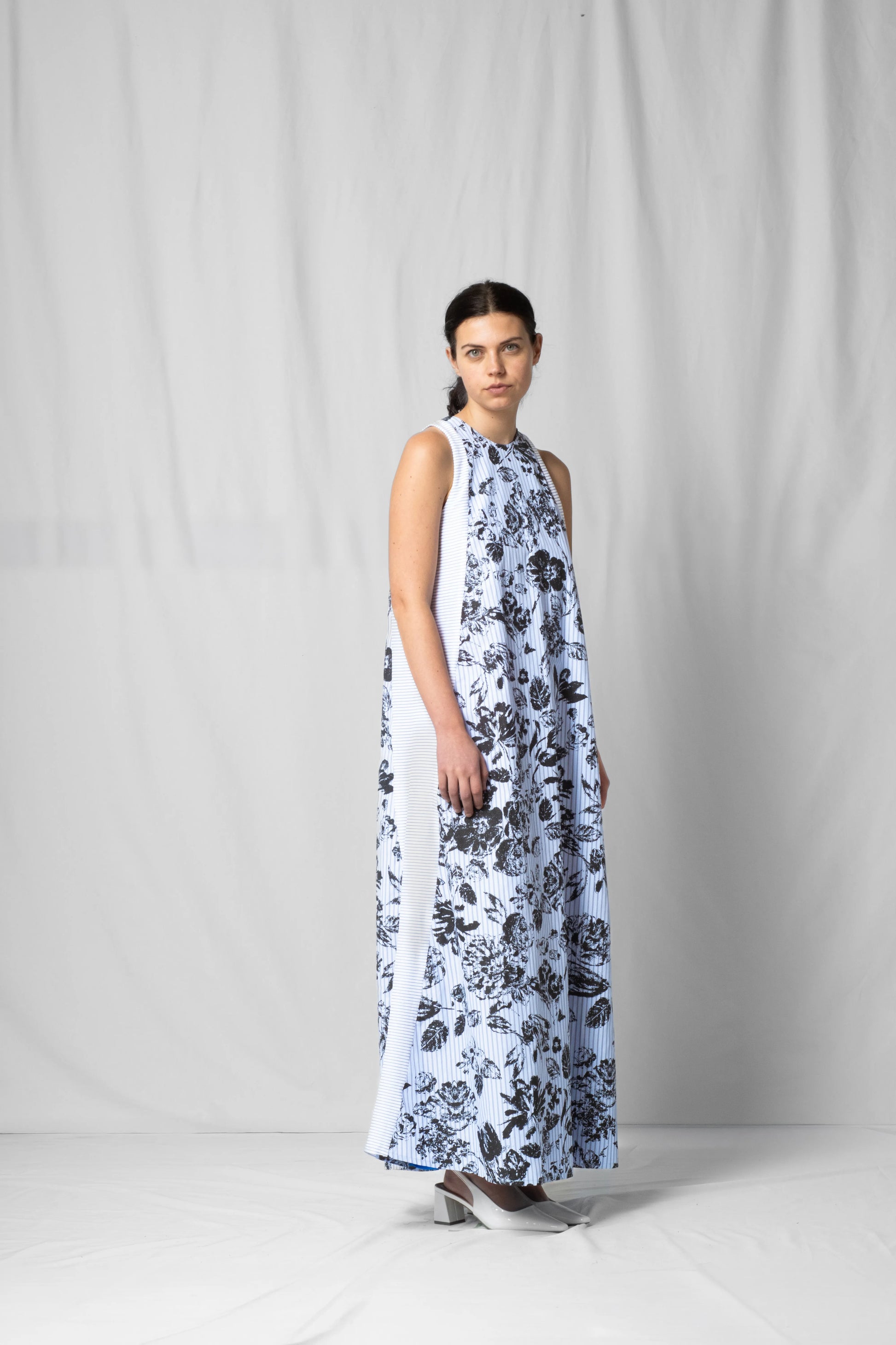 long, wide black flowers halter dress with a two-fabric detail and button fastening at the back from the SS26 collection by STEF SERIES