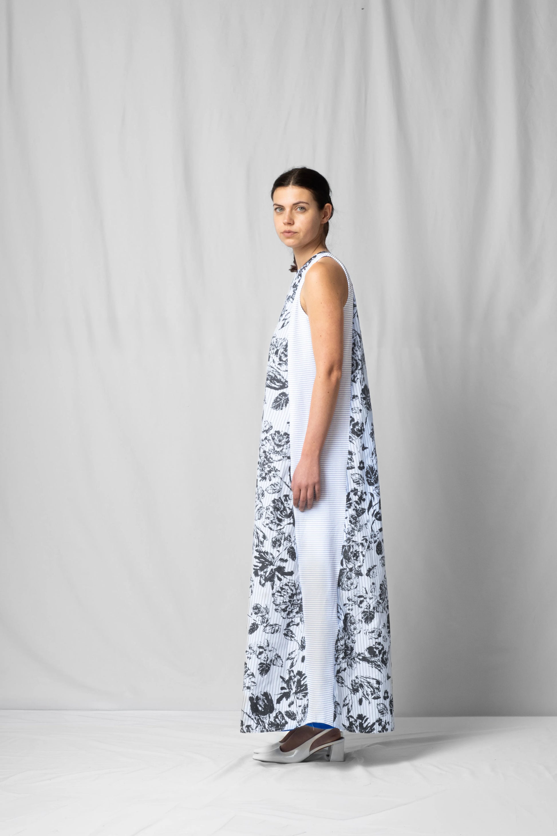 long, wide black flowers halter dress with a two-fabric detail and button fastening at the back from the SS26 collection by STEF SERIES