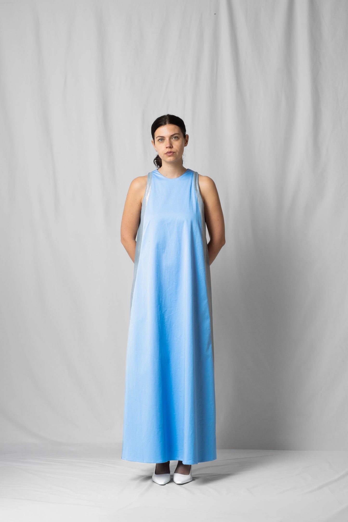 long, wide ciel blue halter dress with a two-fabric detail and button fastening at the back from the SS26 collection by STEF SERIES