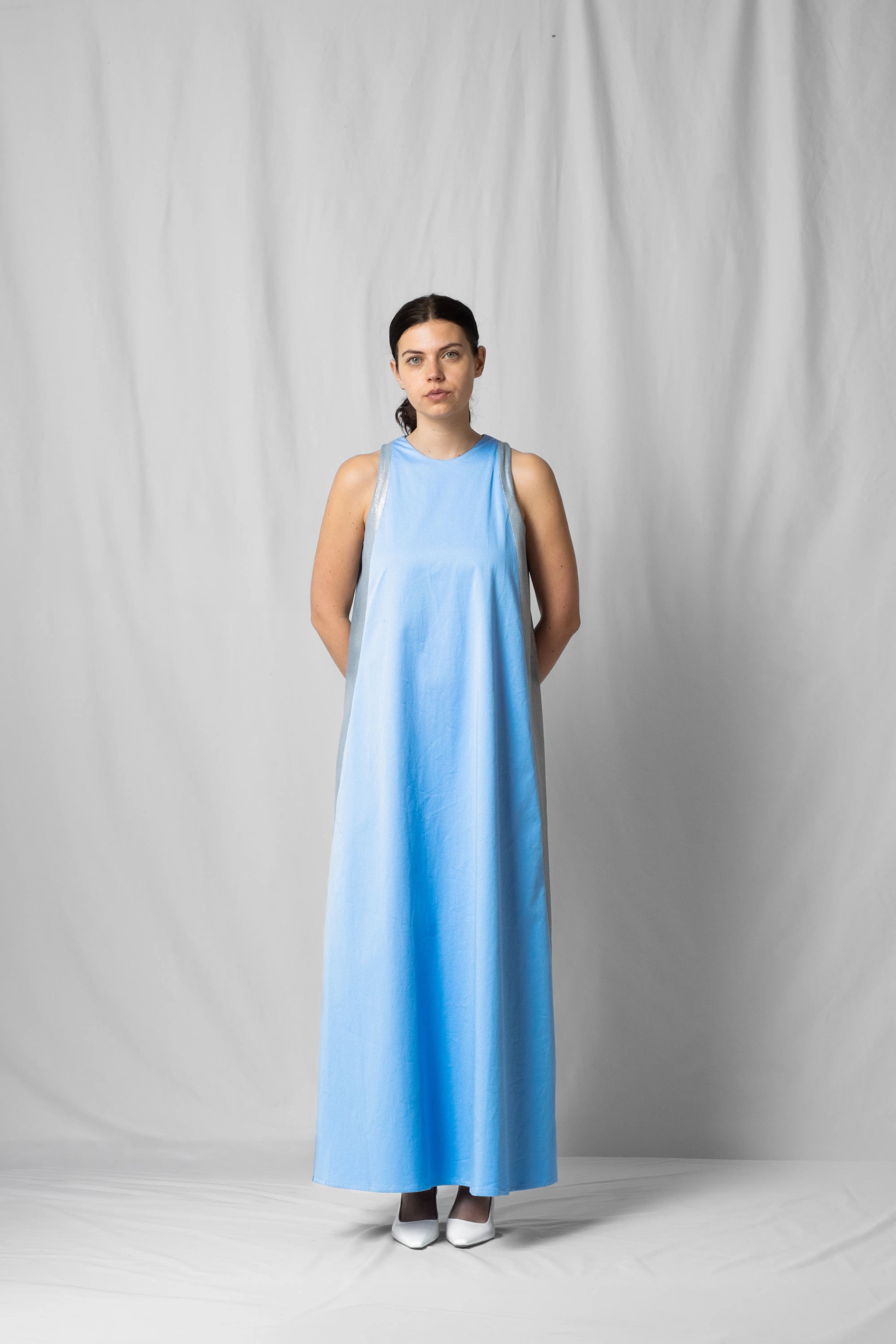 long, wide ciel blue halter dress with a two-fabric detail and button fastening at the back from the SS26 collection by STEF SERIES