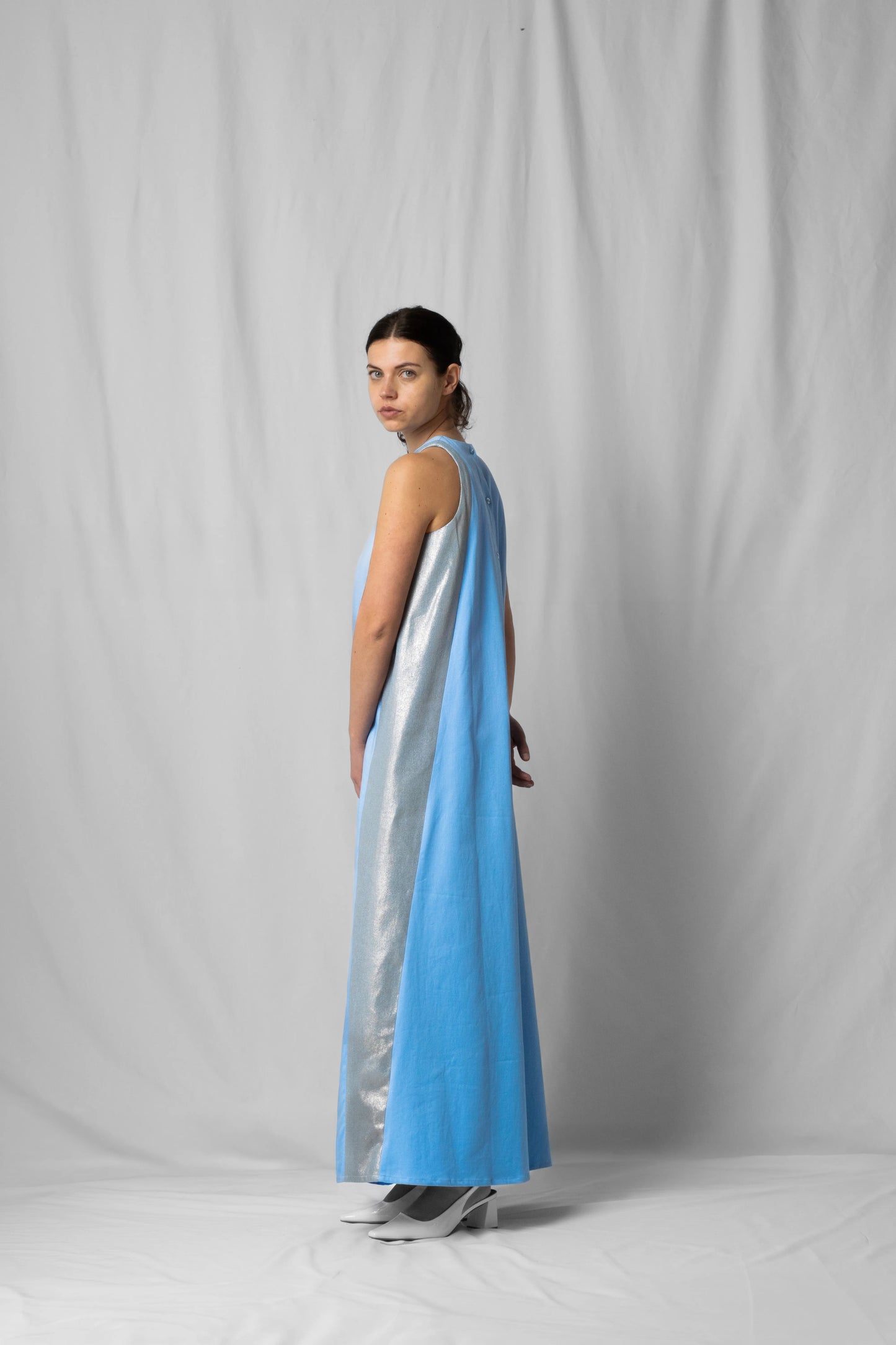 long, wide ciel blue halter dress with a two-fabric detail and button fastening at the back from the SS26 collection by STEF SERIES