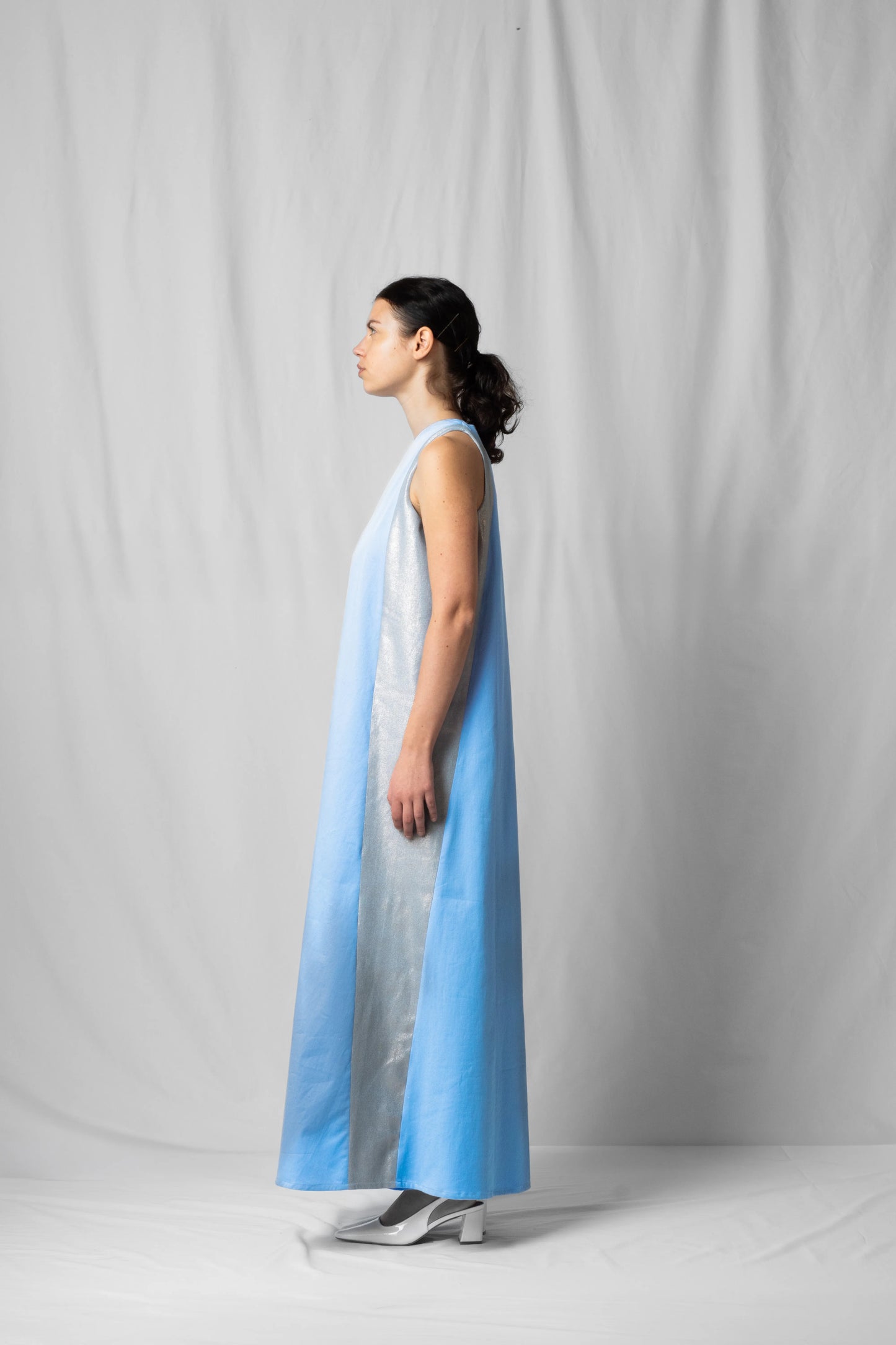 long, wide ciel blue halter dress with a two-fabric detail and button fastening at the back from the SS26 collection by STEF SERIES