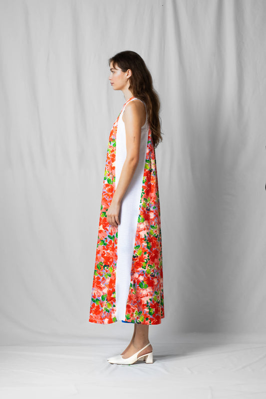 long, wide pink flowers halter dress with a two-fabric detail and button fastening at the back from the SS26 collection by STEF SERIES