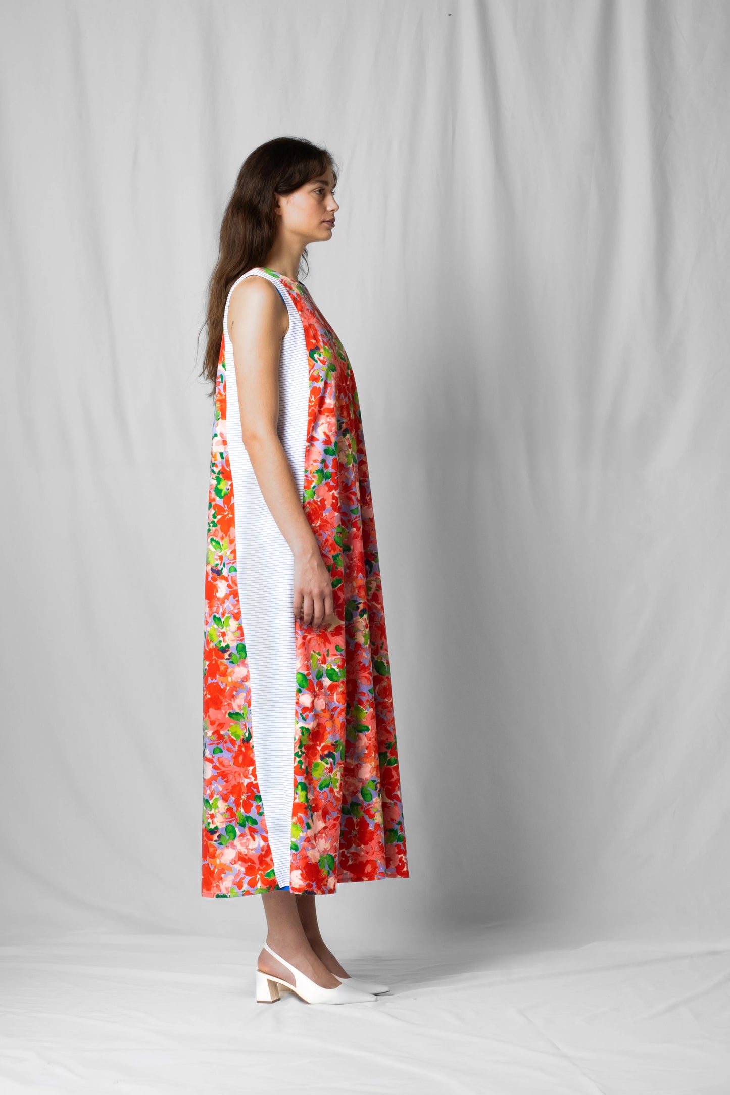 long, wide pink flowers halter dress with a two-fabric detail and button fastening at the back from the SS26 collection by STEF SERIES