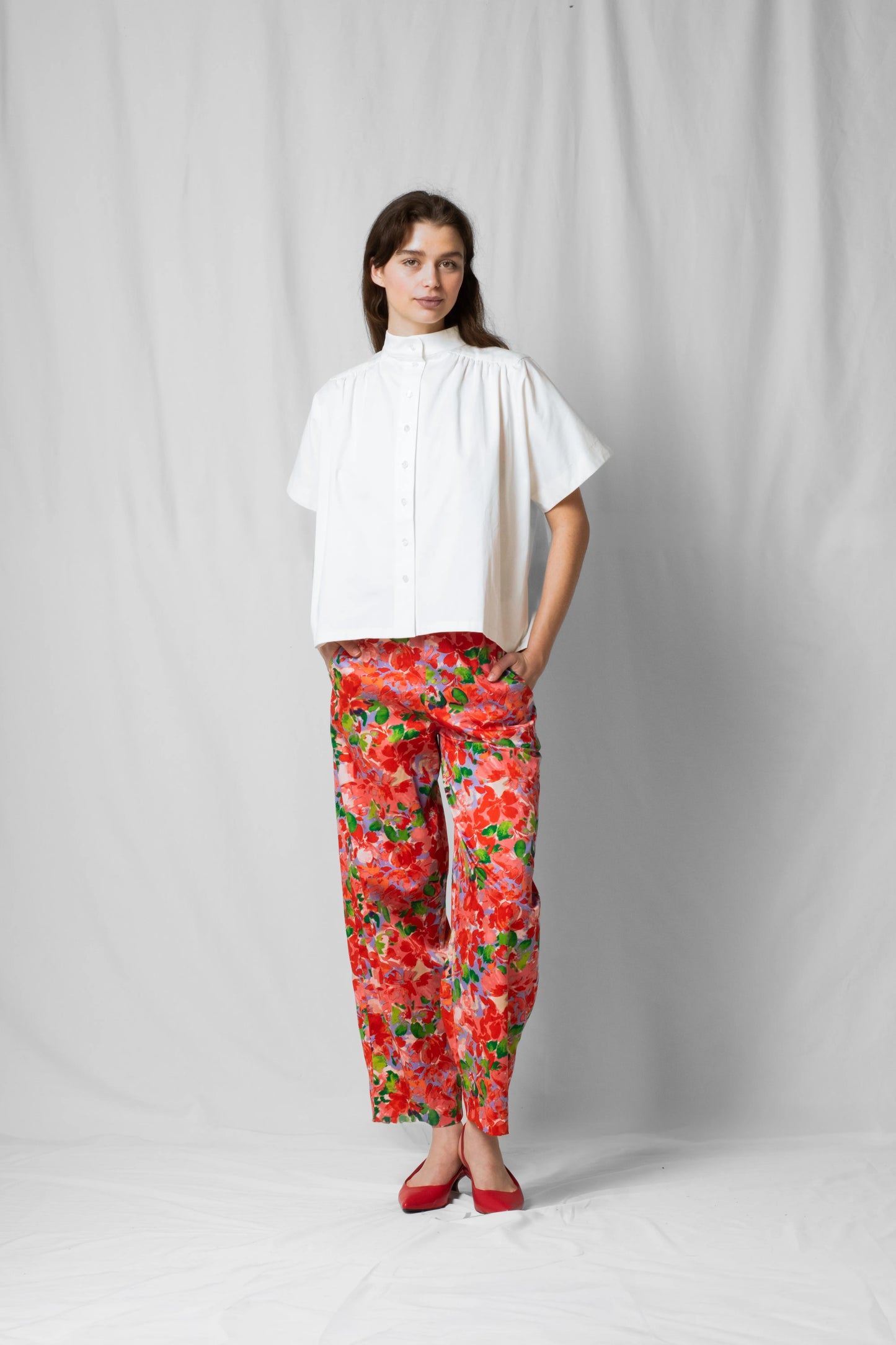 Model wearing balloon shaped bash pants in pink flowers from the SS26 limited collection with numbered pieces by STEF SERIES.