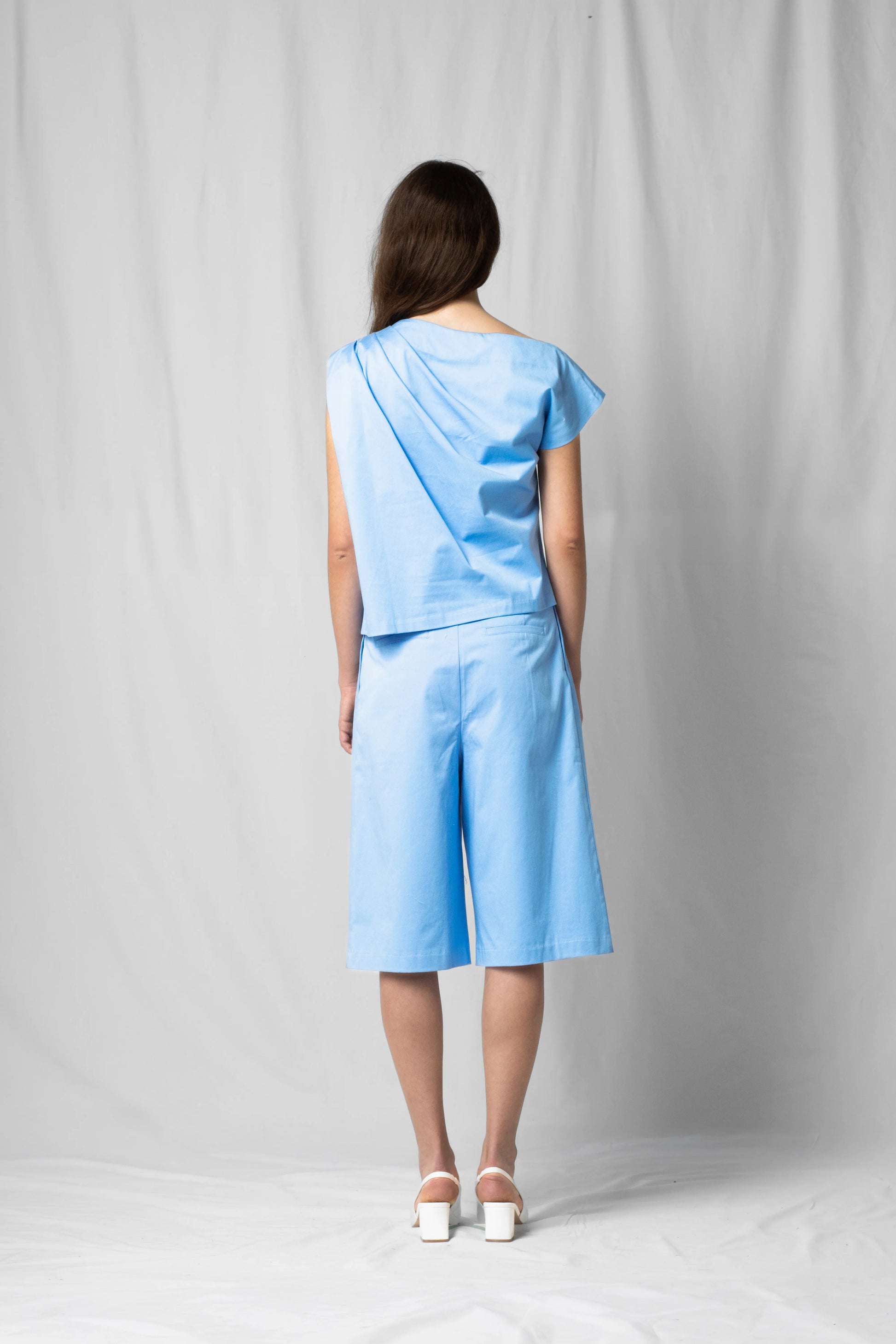 Ciel blue Asymmetric off-shoulder top bea with pleated detailing from the SS26 collection by STEF SERIES